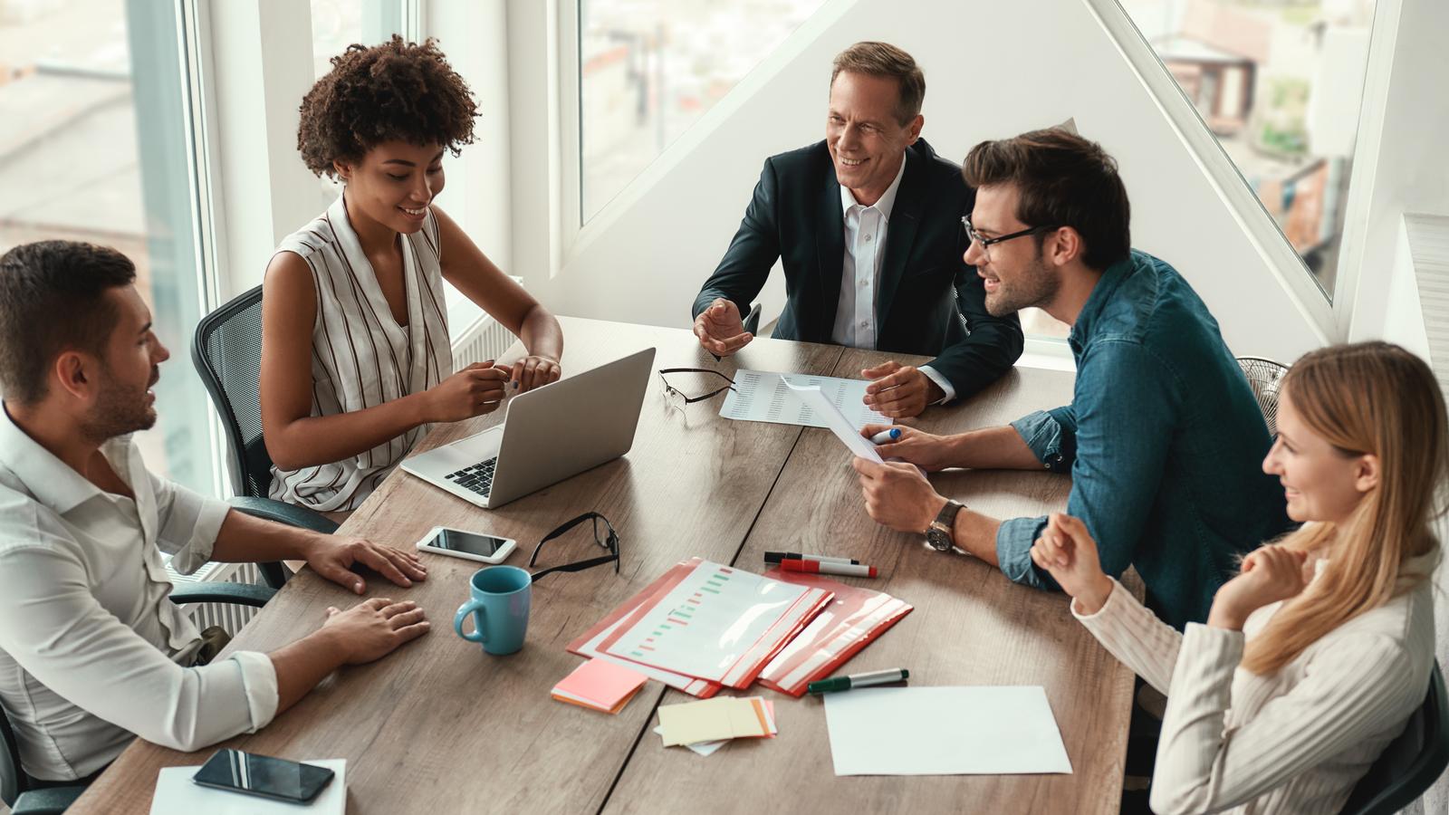 A team collaborating around a table during a strategy session